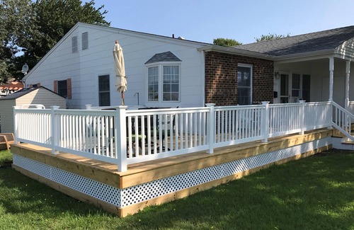 Village Green House | Beautiful corner property with cozy beach vibe.