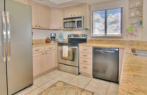 Madeira Beach Condo | Beautiful corner condo w/ample balcony, beach views, W/D, heated pool, pool spa