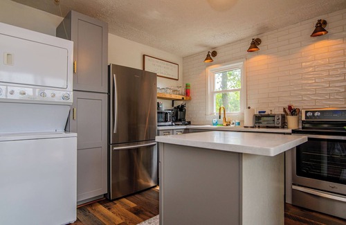 North Shore Acres House | Beautiful lake front cottage, deep water lot with covered dock and amenities.