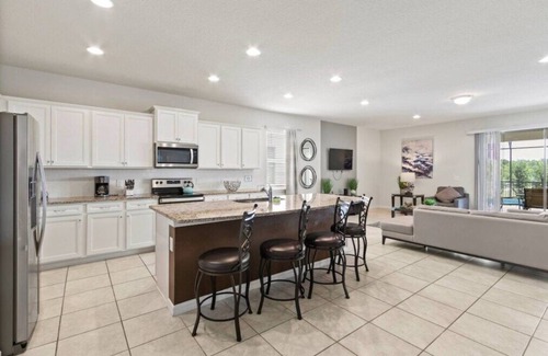 West Kissimmee House | Beautiful Lakeside 8BDR Home mins from Disney with Private Pool & Resort Access!