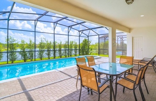 West Kissimmee House | Beautiful Lakeside 8BDR Home mins from Disney with Private Pool & Resort Access!