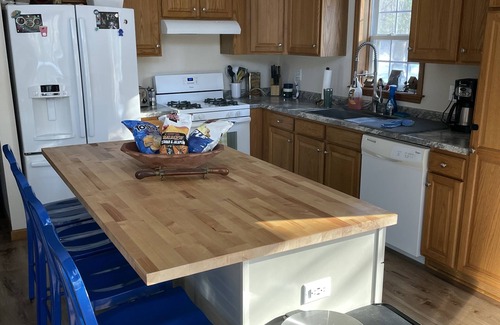 Muskegon House | Beautiful private getaway in updated Cape Cod style home on the river.