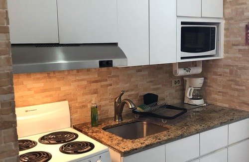 Isla Verde Apartment | Beautiful Studio + Wi-Fi + private parking in ESJ Towers Condominium.