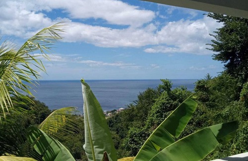 Mahaut Apartment | Beautiful sunset and Mountain View 2 bedroom apt