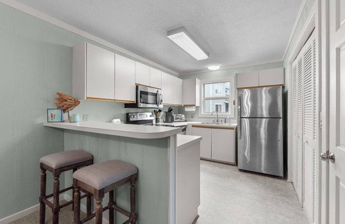 Ocean Sands Condo | Beautifully decorated condo in Corolla with community pool outside!
