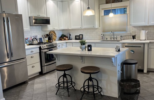 Hilltop House | Beautifully renovated 100yr old craftsman home near Stadium District.
