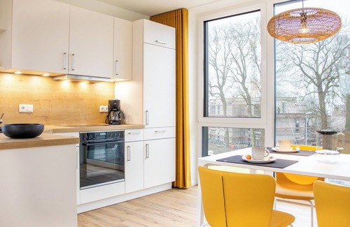 Marienleuchte Apartment | BeltBlick 30 - roof terrace. Sauna. Sea view. Family-friendly.