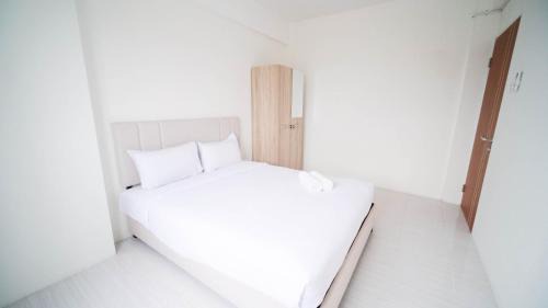 Surabaya Apartment | Best Choice 2BR at Puncak Dharmahusada Apartment Surabaya By Travelio