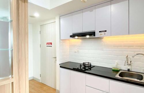 Pekayon Jaya Apartment | Best Modern Studio at Grand Kamala Lagoon Apartment By Travelio