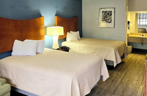 Orange Hotel | Best Price Motel and Suites