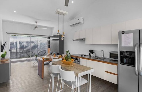 Barrio Ricos y Famosos Condo | Best vacation rental to enjoy. Close to Beach and Town. Fully equipped Condo.