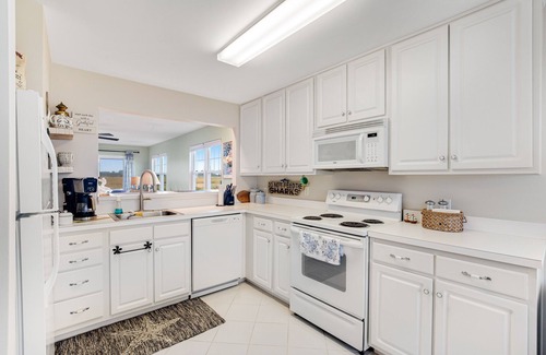 Ocean View Condo | Bethany Bay condo with pool, fireplace, screened porch & AC