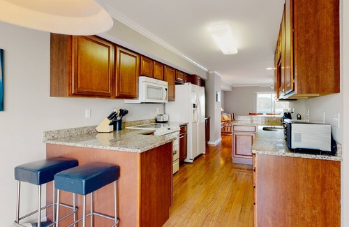 Ocean View Condo | Bethany Marina bayfront condo with pool, 4 bikes, fireplace, water views