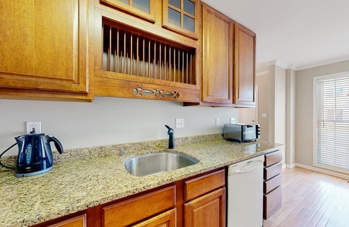 Ocean View Condo | Bethany Marina bayfront condo with pool, 4 bikes, fireplace, water views