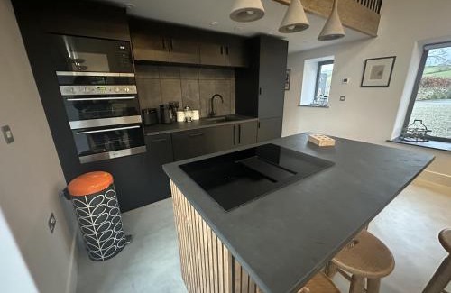 Carmarthen House | Beudy at Pentrecelyn - a gorgeous barn conversion with hot tub