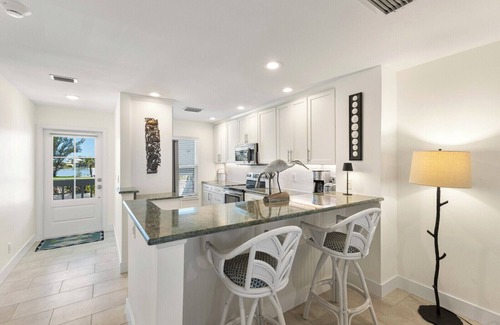 Boca Grande House | BG Grande 34 - 2 Bed/2 Bath Top Floor - Bayfront - Watch the Sunrise with Coffee!