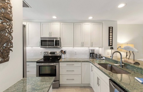 Boca Grande House | BG Grande 34 - 2 Bed/2 Bath Top Floor - Bayfront - Watch the Sunrise with Coffee!