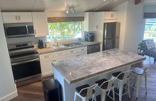 Treasure Cay House | Big Yellow House with Dock on Deep Water Canal and Dock Power Available