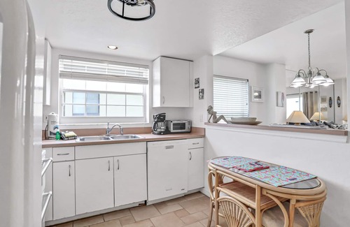 Independence Square Condo | Blissful condo with pool - Gulf-view balcony, private W/D & central AC