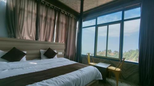 Kempty Range Hotel | Blossom Dhanaulti