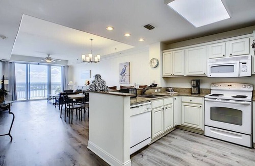 Florida Central Atlantic Coast Condo | Blue Heron Escape accommodates 8 and on the Lake