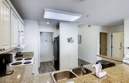 Florida Central Atlantic Coast Condo | Blue Heron Escape accommodates 8 and on the Lake