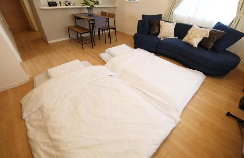 Ojima Island Apartment | blue sea and house