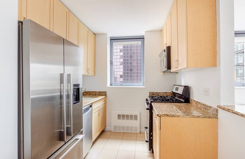 Central New York City Apartment | Blueground | Theater District, gym & AC, nr Times Sq