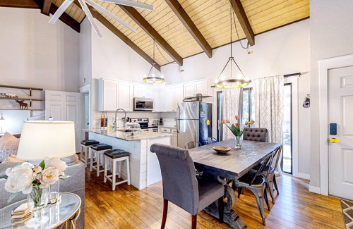 Pinetop Condo | Bohemian condo with updated interior, work desk, fireplace, & mountain views