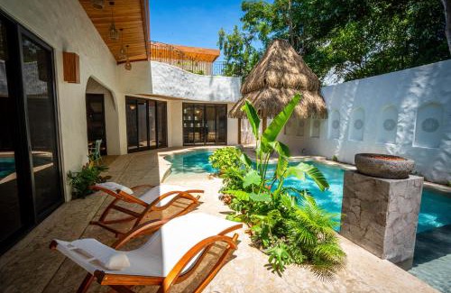 Potrero House | Bohemian Tropical Villa with a Tiki-Style Swimming Pool & Swim-Up Bar with an Attached Studio Apartment