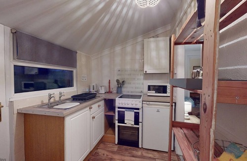 Hayle Ski Chalet | Bojago soaks up the evening sun, which can be enjoyed from an elevated rear garden. Sea Views.