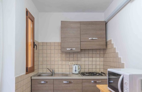 Portisco Apartment | Bouganville - Flat with sea view and WiFi