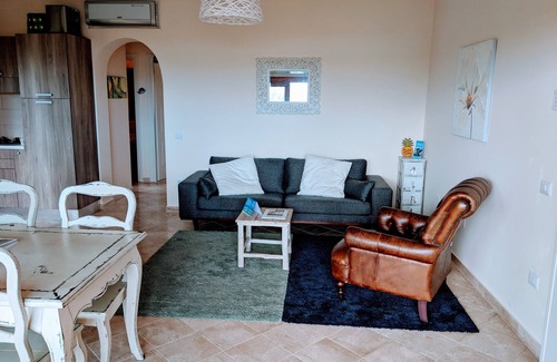 Porto Pozzo Apartment | Boutique Seaview Apartment with large pool and private garden.