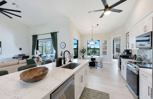 Pelican House | BRAND NEW- Gulf access electric heated pool home sleeps up to 13 guests