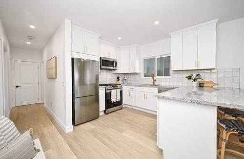 Sunset Beach House | Brand New Home by the Beach & Historic Sunset Water Tower