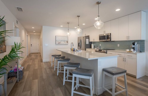 Madeira Beach Condo | BRAND NEW LUXURY CONDO WITH HEATED POOL - 1 BLOCK FROM GULF W/WATER VIEWS!