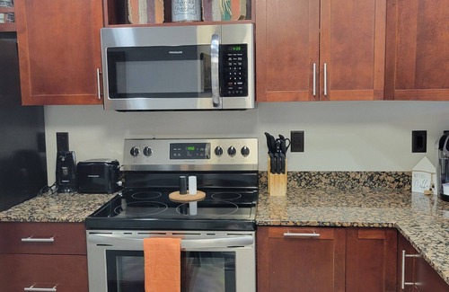 Pigeon Forge Condo | Breathtaking sunsets, wraparound balcony, pools, and more await you this Summer!