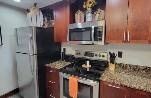 Pigeon Forge Condo | Breathtaking sunsets, wraparound balcony, pools, and more await you this Summer!