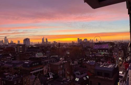 Soho Apartment | Bright 2-Bedroom in Soho High-Rise with Skyline Views