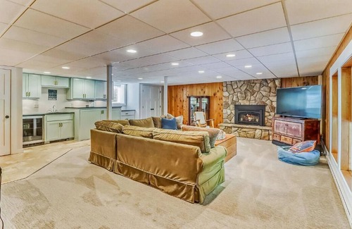 Detroit Lakes House | Bright and Modern Luxe on Long. Peloton bike in unit