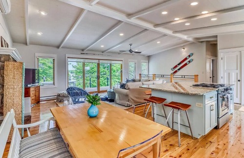 Detroit Lakes House | Bright and Modern Luxe on Long. Peloton bike in unit