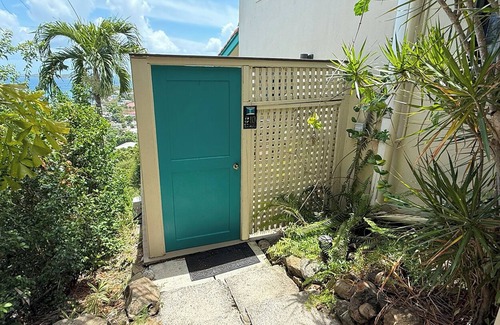 Estate Enighed Condo | Bright and welcoming corner condo with a lovely wrap-around deck—ideal for soaking in those beautiful sunsets!
