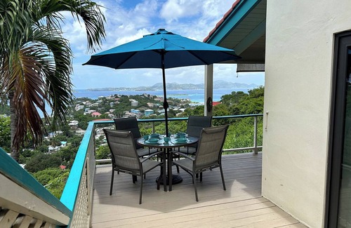 Estate Enighed Condo | Bright and welcoming corner condo with a lovely wrap-around deck—ideal for soaking in those beautiful sunsets!