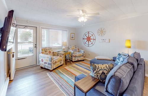North Ocean City Condo | Bright condo feet from the sand with furnished patio, fast WiFi & ideal location