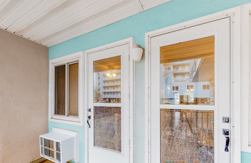North Ocean City Condo | Bright condo feet from the sand with furnished patio, fast WiFi & ideal location
