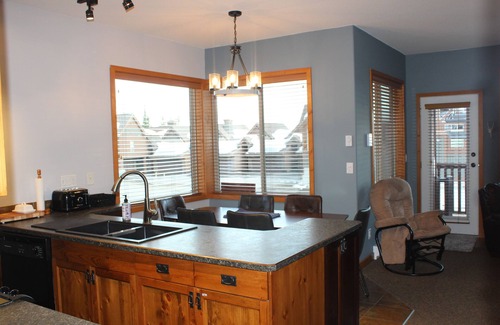 Big White Ski Resort Ski Chalet | Bright End unit Townhome, priv. hot tub, 2 parking, ski in/out, close village