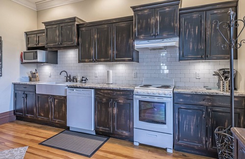 Vernon Apartment | Bright Ground Level Studio Suite is situated in the Historical Carew House