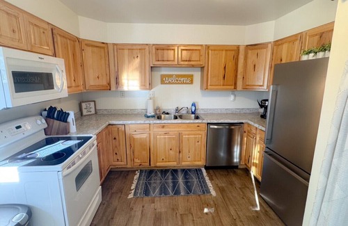 Spearfish Apartment | Bright, King Beds, Patio, Laundry, Walk to Downtown!