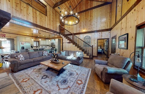 Hochatown Cabin | Bring your ATVs and side by sides to this luxurious 4 bedroom cabin set deep in