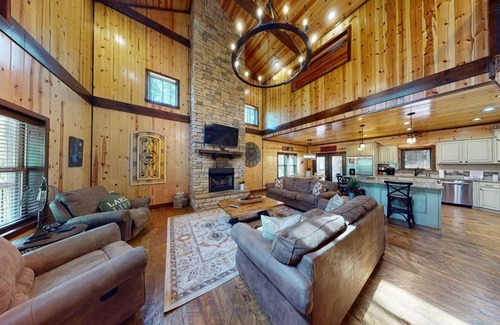 Hochatown Cabin | Bring your ATVs and side by sides to this luxurious 4 bedroom cabin set deep in
